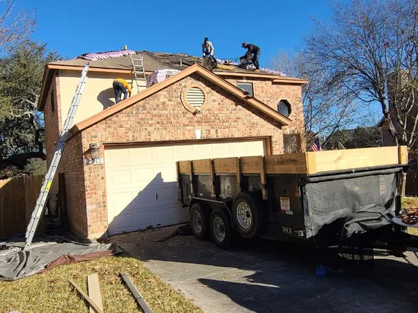 Crew at work on a two-story re-roof