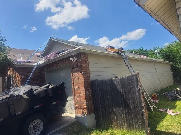 Tear-off with dump trailer staged