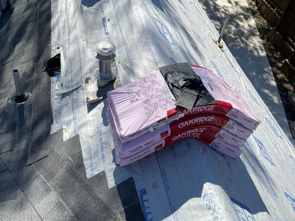 Shingle bundles loaded on the roof