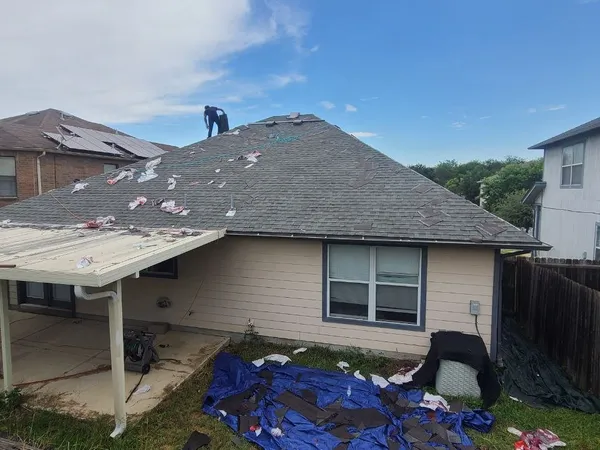 Tear-off with tarps protecting the yard